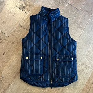 Navy and white pin stripe jcrew puffer vest with gold details